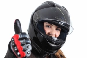 Happy Biker Woman With A Road Helmet And Thumb Up